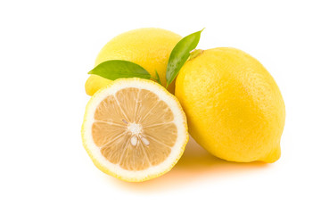 Yellow Lemon citrus half slices with leaf isolated on white background - obrazy, fototapety, plakaty