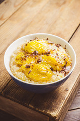 Oatmeal with roasted bananas and chocolate. Selective focus. Shallow depth of field.