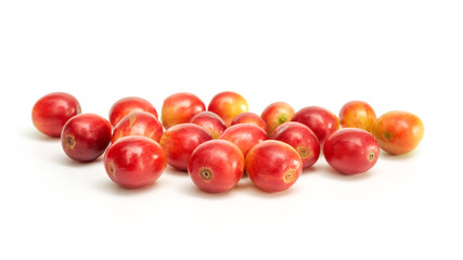 Fresh arabica coffee beans on a white background.