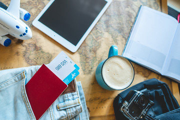 Passport and two air tickets sticking out of the pocket of jeans. Gathering for a trip or travel to meet adventures.