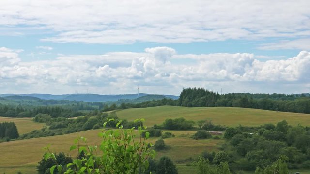Time lapse of an idyllic German hilly summer landscape with moving clouds