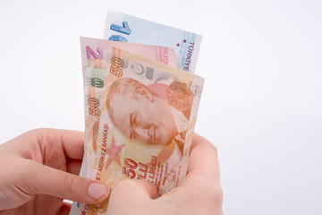 Hand holding Turksh Lira banknotes  in hand