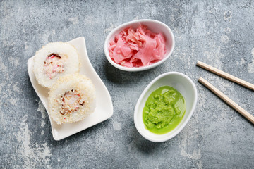 Sushi set on grey stone background.