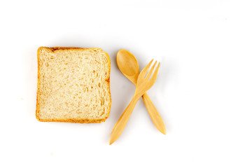 sliced bread and spoons isolated on white backgroun isolated on white backgroun