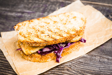Freshly cooked sandwiches with roasted chicken, purple cabbage and mushrooms. Selective focus. Shallow depth of field.