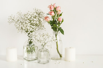 Romantic wedding flowers arrangement on table wall background. Front view mockup
