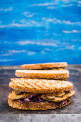 Freshly cooked sandwiches with roasted chicken, purple cabbage and mushrooms. Selective focus. Shallow depth of field.