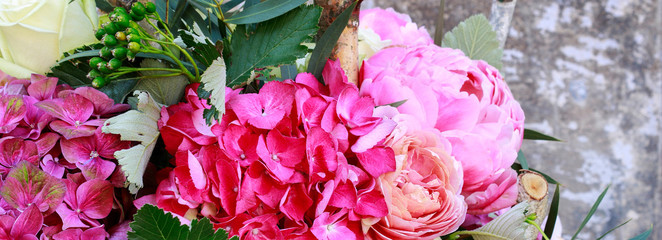 Flower background with roses, peonies, hortensias, carnations and other flowers.