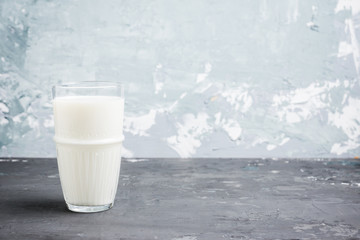 Glass of cold milk on the rustic background. Selective focus. Shallow depth of field.