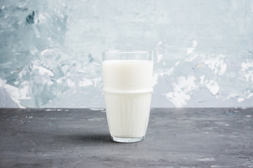 Glass of cold milk on the rustic background. Selective focus. Shallow depth of field.