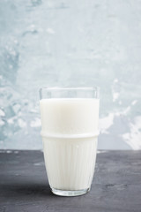 Glass of cold milk on the rustic background. Selective focus. Shallow depth of field.