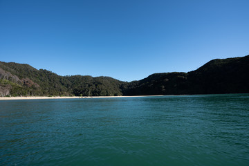 Fototapeta na wymiar The Abel Tasman National Park beach on a beautiful sunny day