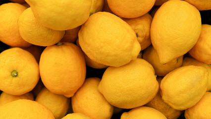 Lemon background . Colorful Display Of Lemons In Market . healthy food