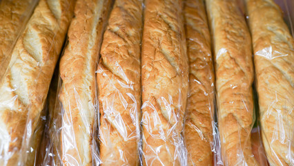 fresh baguettes long loaf in a wicker basket in a bakery store