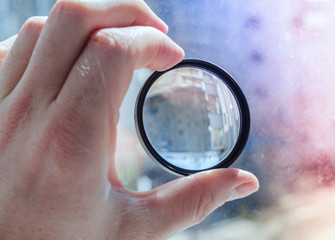 magnifying glass in man's hand
