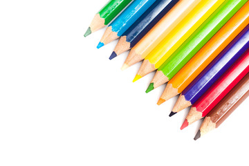 Colored pencils background with a variety of colors. Many different color pencils on white background. Colored Pencils for School or Professional Use.