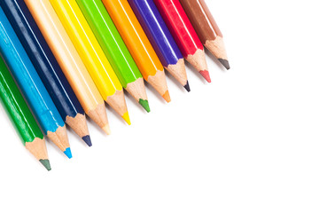Colored pencils background with a variety of colors. Many different color pencils on white background. Colored Pencils for School or Professional Use.