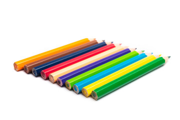 Colored pencils background with a variety of colors. Many different color pencils on white background. Colored Pencils for School or Professional Use.