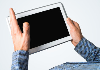 Hands of businessman holding tablet pc with black screen