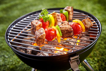 Assorted grilled meat with vegetable on a grill