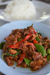 Spicy fried deer Thailand food on blue plate