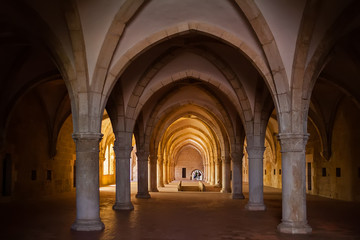 Fototapeta na wymiar Alcobaca, Portugal. Monks dormitory of Monastery of Santa Maria de Alcobaca Abbey. Masterpiece of Medieval Gothic architecture. Cistercian Religious Order