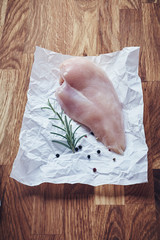 Fillet of raw fish with rosemary and peppercorns