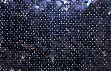 metallic sparkling sequins scales background, round sequins in fashion dress,