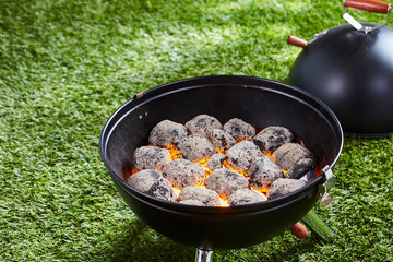 Hot charcoal or briquettes in a barbecue