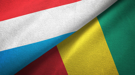 Luxembourg and Guinea two flags textile cloth, fabric texture