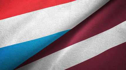 Fototapeta na wymiar Luxembourg and Latvia two flags textile cloth, fabric texture