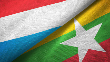 Luxembourg and Myanmar two flags textile cloth, fabric texture