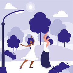 young interracial girls dancing in the park