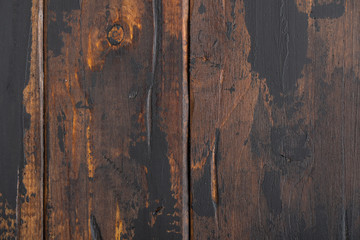 The old wooden surface background, scuffed boards with black paint stains.