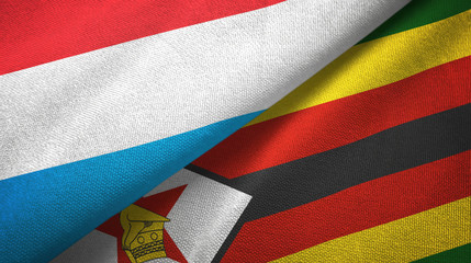 Luxembourg and Zimbabwe two flags textile cloth, fabric texture