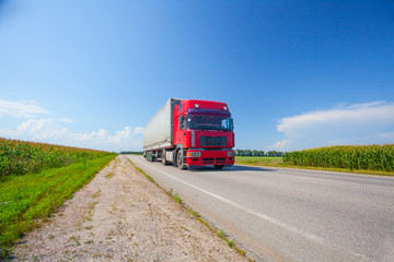 delivery truck outdoor on the highway ounder the blue cloudy sky  in Ukraine © Alexandra Lande