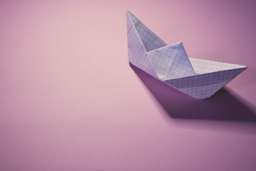 Paper ship on colorful backgrounds