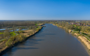 Aerial view of the Scheldt river, separating the communes of Dendermonde and Hamme
