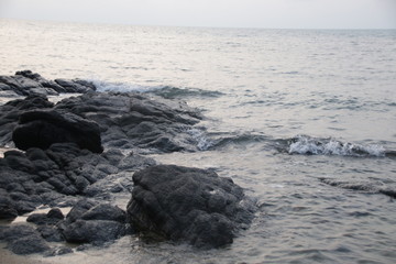 Sea Wave hits the Grey Rock on the Beach, Summer Holidays