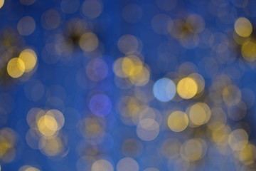 Small yellow and blue round bokeh bubbles on a nice blue background