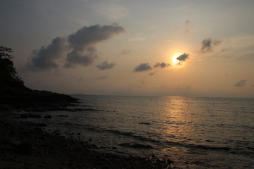 Beautiful Moment of the Sky when the Sun is Rising from the Horizon of the Ocean, Strolling by the beach, Summer Holidays
