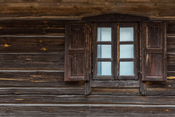 Obraz na płótnie Canvas Window in Log House in Lithuania