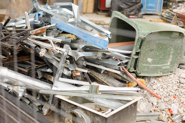 Removal of debris. Construction waste. Building demolition. Loaded dumpster near a construction site