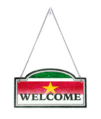 Suriname welcomes you! Old metal sign isolated