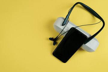 portable speaker on yellow color background