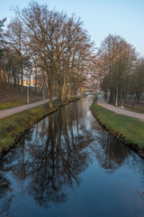 Stream Flowing through a Park in Poland at Sunrise