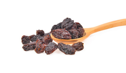 Black raisins on  white background