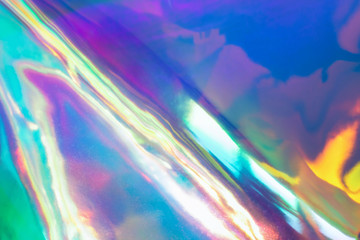 Abstract trendy holographic background. Real texture in pale violet, pink and mint colors with...