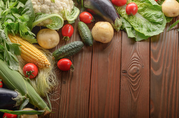 Fresh Organic Vegetable Food Ingredients on Wooden kitchen table background. Space for text.