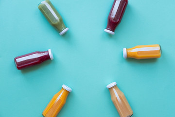 Рealthy eating, drinks, diet and detox concept - close up of bottles with different fruit or vegetable juices